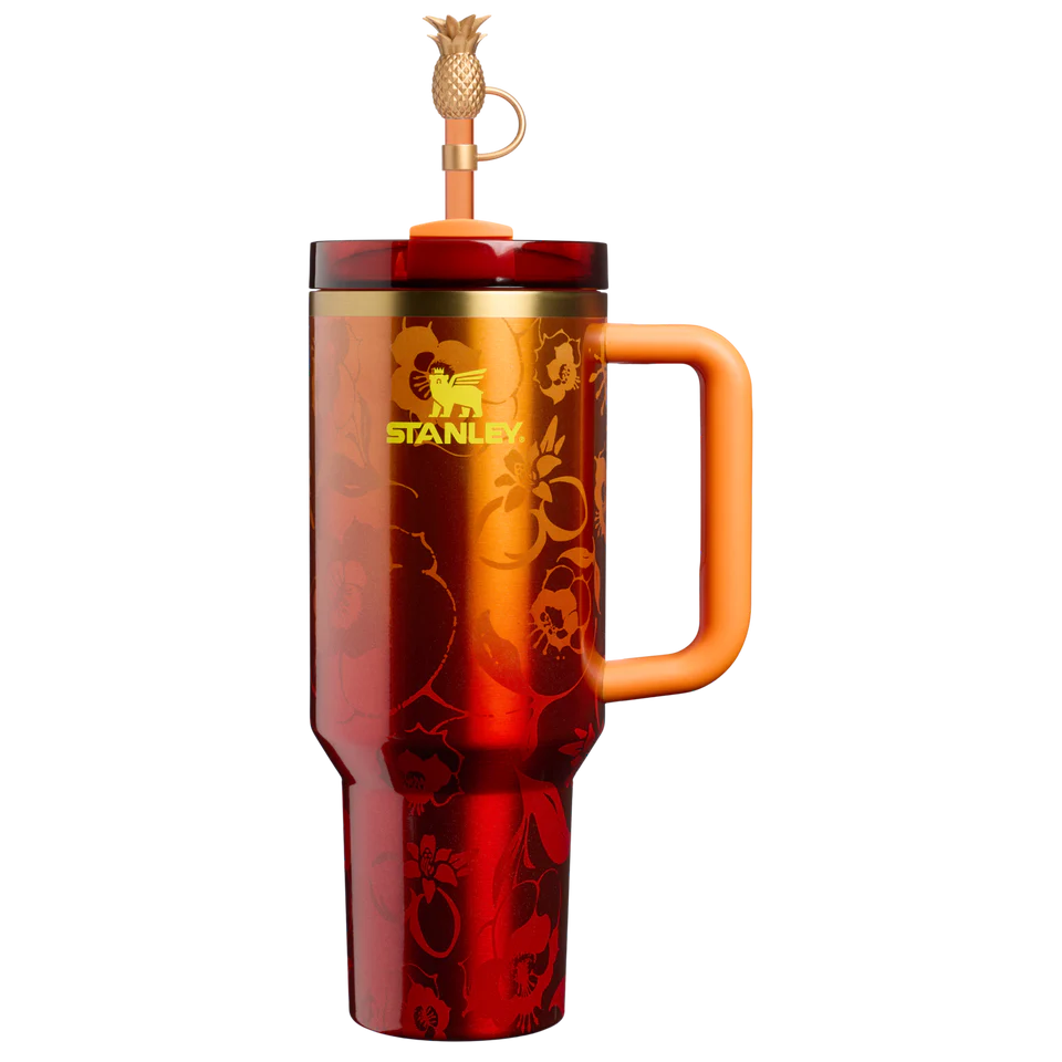 Stanley x Karol G 40 oz Quencher Tumbler in ruby red with floral artwork and pineapple straw topper next to its orange collector box - View 3 | Clistos